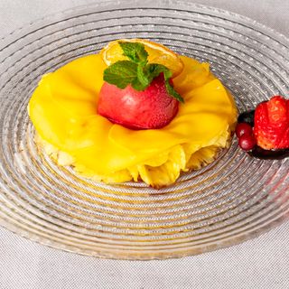 Carpaccio de piña y mango con sorbete de frutas frescas