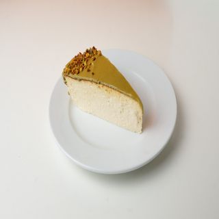 Tarta de queso y pistacho (porción)