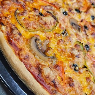 Pizza Vegetariana individual (imagen ilustrativa)