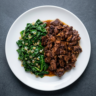Braised Beef In Savory Sauce (Beef Karanga) With Sautéed Greens