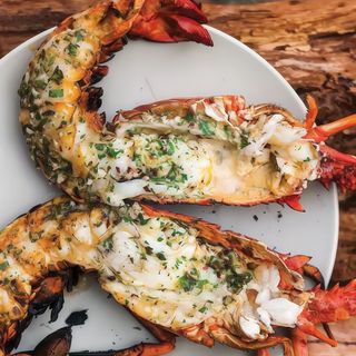 Grilled lobster with chips and salad