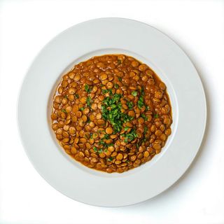 Lentejas Negras Preparadas Con Mantequilla En Salsa De Casa