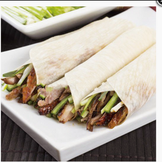 202.Pato laqueado con 12 crepes 