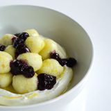 Cottage cheese balls fondant with mousse and blueberry compote.