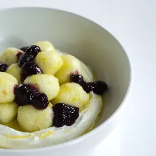 Cottage cheese balls fondant with cream cheese mousse and blueberry compote