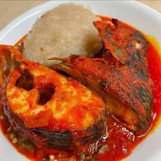 White Eba served with tilapia fish mixed with okro 