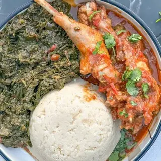 White ugali served with kuku kienyeji and managu veges