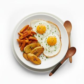 Yam with fried egg and plantain