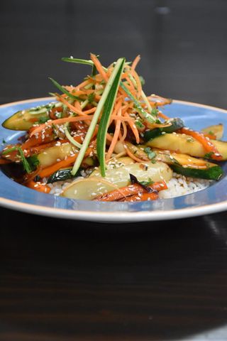 Seasonal fresh vegetables from wok with sesame and rice
