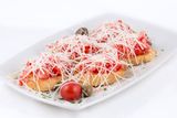Bruschetta with prosciutto, cheese and tomato 200 gr
