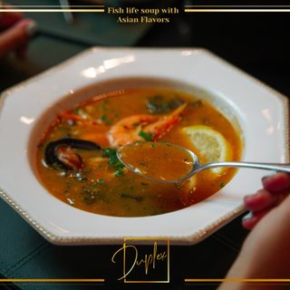 Fish life soup with asian flavors