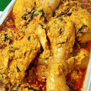 Egusi mixed with  chicken drumsticks and Gizzards 
