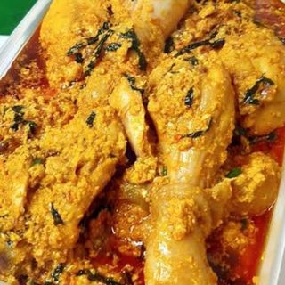 Egusi mixed with  chicken drumsticks and Gizzards 