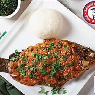 Large wet fried tilapia(fish) with ugali