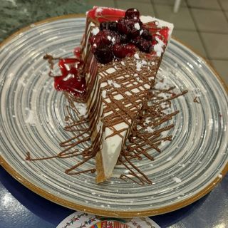 Cheesecake di ricotta di bufala con fonduta di nutella e frutti rossi