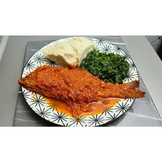 Whole fish Curry ugali & greens