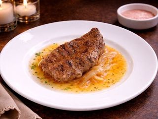 Стейк свинний в соусі (100g)