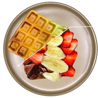 Spinach waffle with chocolate pasta , strawberries, banana