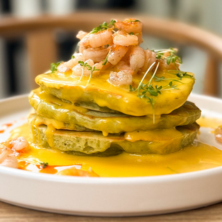 Spinach pancakes with shrimp, and hollandaise sauce