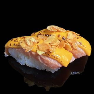 40. Sake flambé cheese