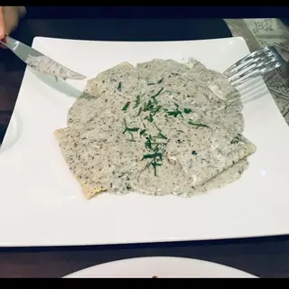 Ravioli Salsa Trufa Negra