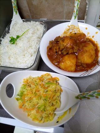 Rice (wali) with  beef stew and  greens
