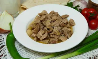 Braised calf meat cubes browned in its own fat