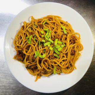 Fried noodles with pork and tomato sauce