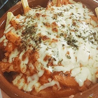 Patatas Pizza (1/2 porción)