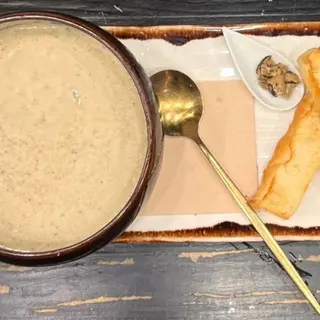 Crema de setas y trufa laminada.