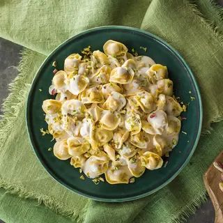 CAPPELLETTI ALLA MORTADELLA CON CREMA DI STRACCHINO,PISTACCHI E LIMONE