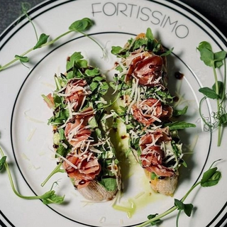 Брускети з прошутто