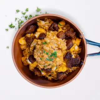 Mote Salteado Con Chicharrón Y Ají De Maní