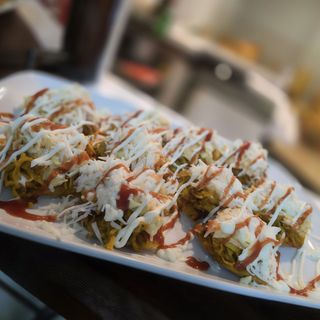 Patacones con pollo / Tostones playeros