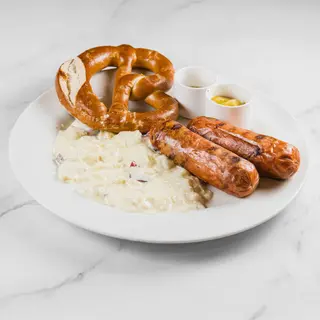 Bockwurste con contorno e Brez'n