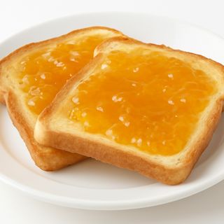 Tostadas de Mantequilla y Mermelada Melocoton