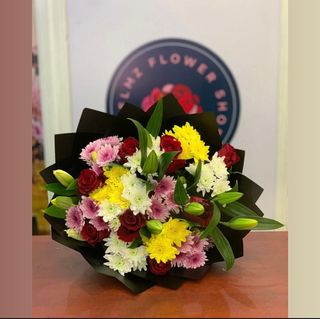 A MEDIUM SIZE BOUQUET OF FLOWERS