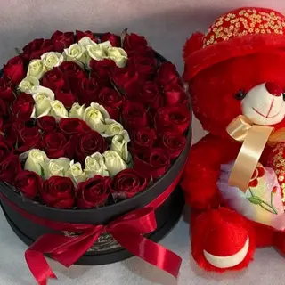 Box de fleurs avec nounours