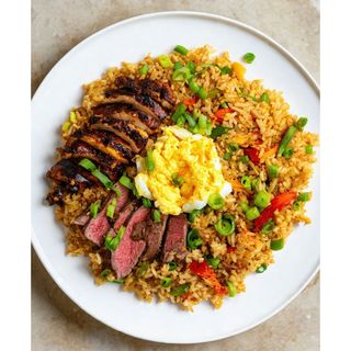 Jollof & fried rice + goat meat + plantain or coleslaw