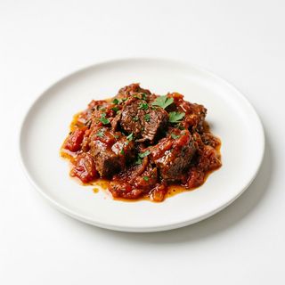 Ternera Con Salsa De Tomate
