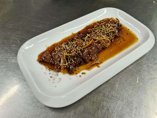 Pato Caramelizado Con Semillas De Sésamo