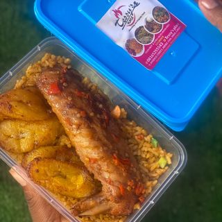 Party jollof rice served with turkey plantain 