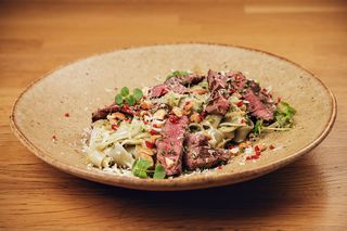 Rice noodles with beef fillet and fresh pesto