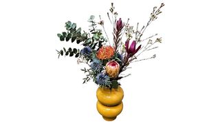 Native flowers in ceramic vase