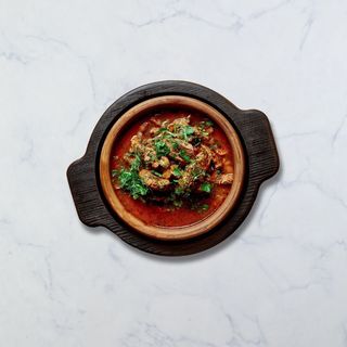 ხბოს ჩაშუშული პომიდორში