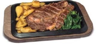 Chuletón con patatas y pimientos del padrón