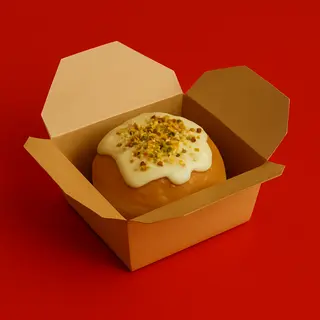 Bomba de pistacho con fonduta de queso
