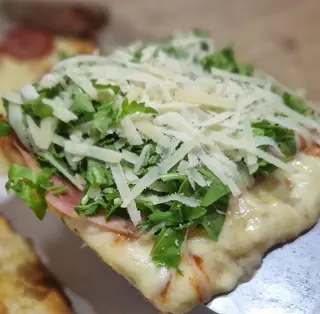Pizza Speck Y Rúcula (Porción)