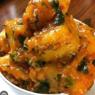 Yam porridge with boiled egg served with either Titus fish or beef 