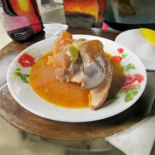 Kigele ( Mulokoni) with parsley potatoes or steamed cassava .
